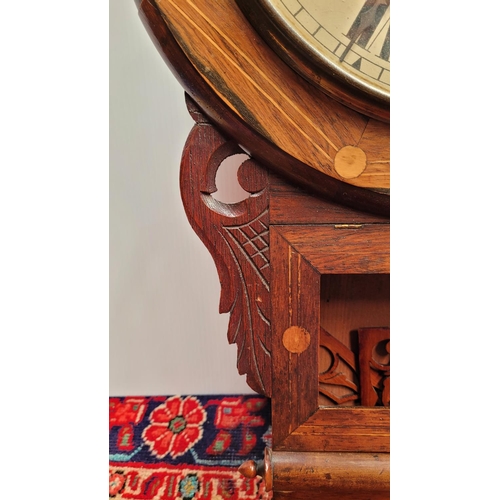 135 - AN AMERICAN INLAID WALL CLOCK, 	with circular clock face decorated with inlaid detail, glazed pendul... 