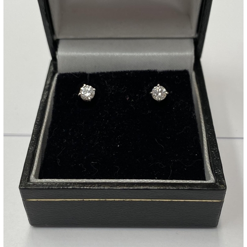 141 - A CLASSIC PAIR OF 18CT WHITE GOLD DIAMOND STUD EARRINGS, each stud is a round brilliant cut diamond,... 