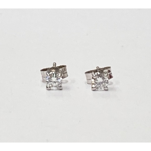 141 - A CLASSIC PAIR OF 18CT WHITE GOLD DIAMOND STUD EARRINGS, each stud is a round brilliant cut diamond,... 