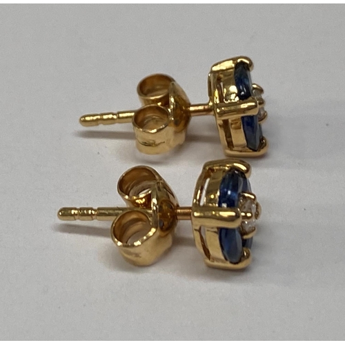 142 - AN ELEGANT PAIR OF 18CT YELLOW GOLD SAPPHIRE & DIAMOND STUD EARRINGS; each stud earring is made up o... 