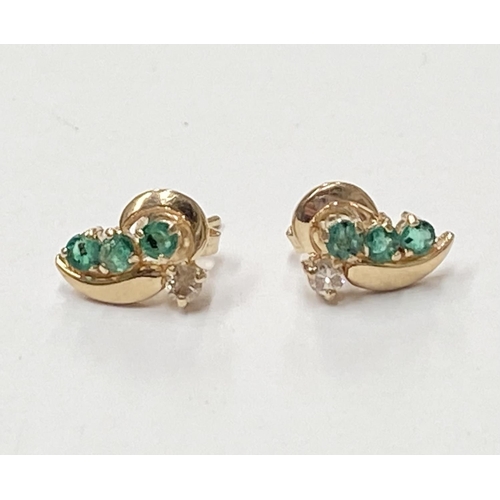 143 - AN ELEGANT PAIR OF 14CT YELLOW GOLD EMERALD & DIAMOND CROSSOVER STYLE EARRINGS; each earring with 3 ... 