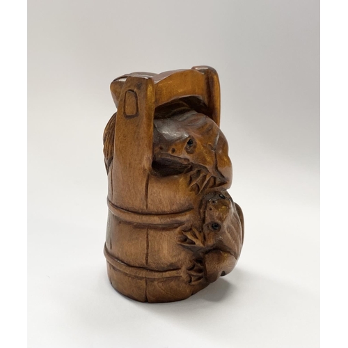 147 - AN EARLY 20TH CENTURY CARVED BOXWOOD NETSUKE of a bucket with two frogs, with signature character ma... 