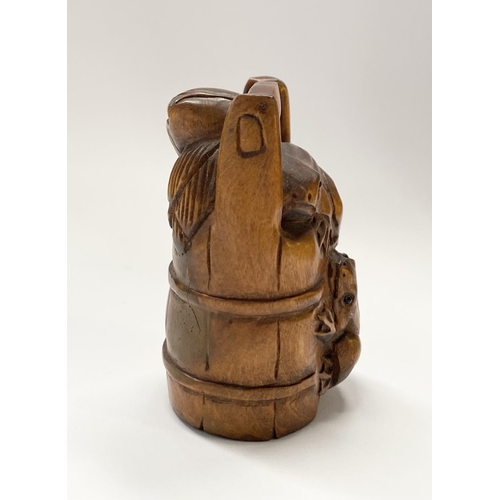 147 - AN EARLY 20TH CENTURY CARVED BOXWOOD NETSUKE of a bucket with two frogs, with signature character ma... 