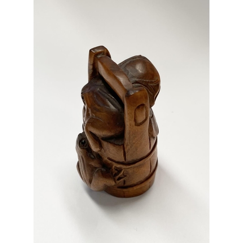 147 - AN EARLY 20TH CENTURY CARVED BOXWOOD NETSUKE of a bucket with two frogs, with signature character ma... 