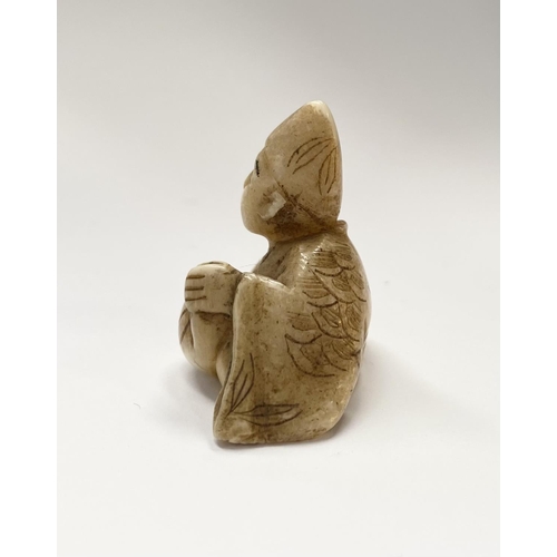 148 - A 19TH CENTURY CARVED IVORY NETSUKE OF A SEATED MAN, robed & wearing a hat, with finely carved detai... 