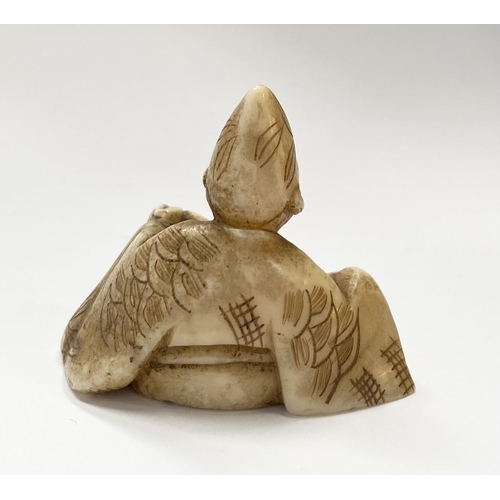 148 - A 19TH CENTURY CARVED IVORY NETSUKE OF A SEATED MAN, robed & wearing a hat, with finely carved detai... 