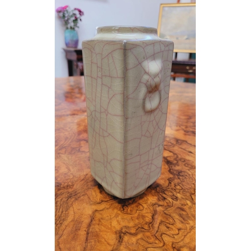 149 - A CONTEMPORARY CELADON GREEN ‘KONG’ VASE, rectangular in shape with a crackled effect, moulded lion ... 