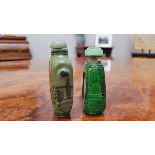 150 - TWO CHINESE SNUFF BOTTLES, (i) A ceramic snuff bottle, with lid and spoon, decorated with images of ... 