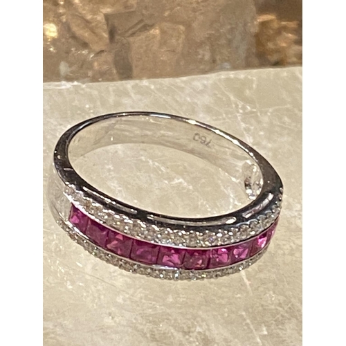 151 - AN 18CT WHITE GOLD RUBY & DIAMOND HALF ETERNITY RING, with a central line of 1.00ct of Burmese rubie... 