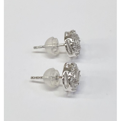 162 - A PAIR OF 18CT WHITE GOLD OVAL DIAMOND CLUSTER STUD EARRINGS, set with round brilliant cut and bague... 