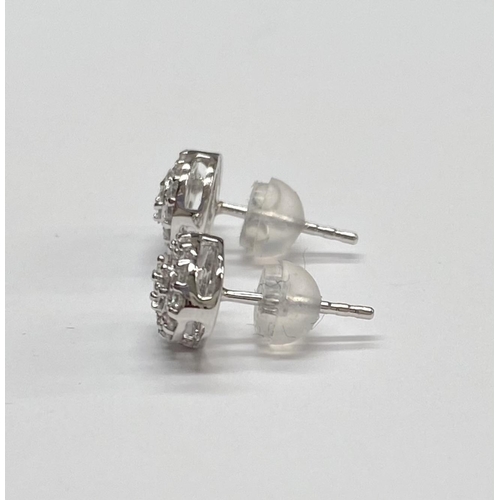 162 - A PAIR OF 18CT WHITE GOLD OVAL DIAMOND CLUSTER STUD EARRINGS, set with round brilliant cut and bague... 