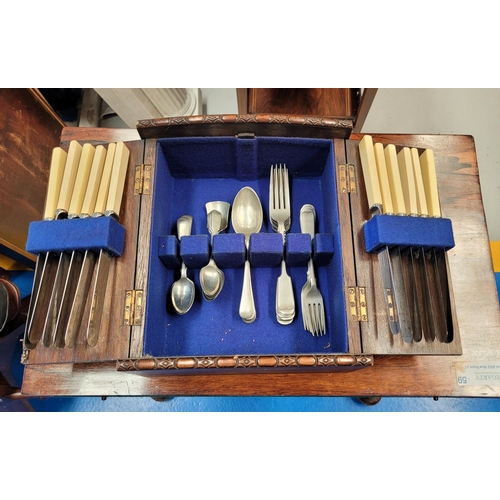 165 - A CASED CANTEEN OF CUTLERY, 	a very fine oak canteen case with carved gadrooned detail to the curved... 