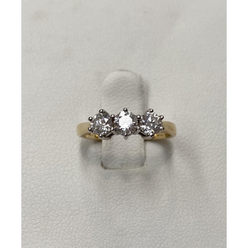 167 - AN 18CT YELLOW GOLD THREE STONE DIAMOND RING, set with three round brilliant cut diamonds, total .90... 