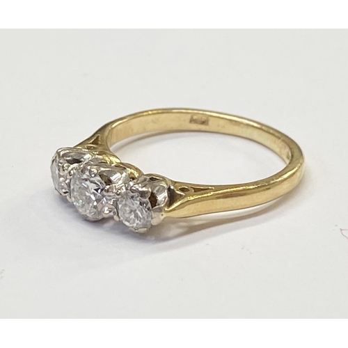 170 - AN 18CT YELLOW GOLD THREE STONE DIAMOND RING, the diamond weight is .60 cts in total , colour G , cl... 