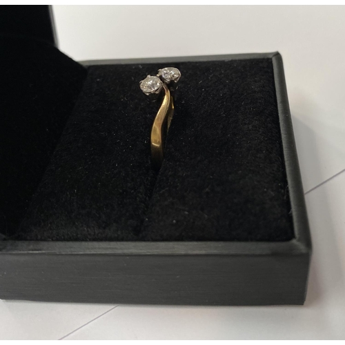 179 - AN 18CT YELLOW GOLD TWO STONE DIAMOND TWIST RING, diamond weight .30cts each and are very secure in ... 