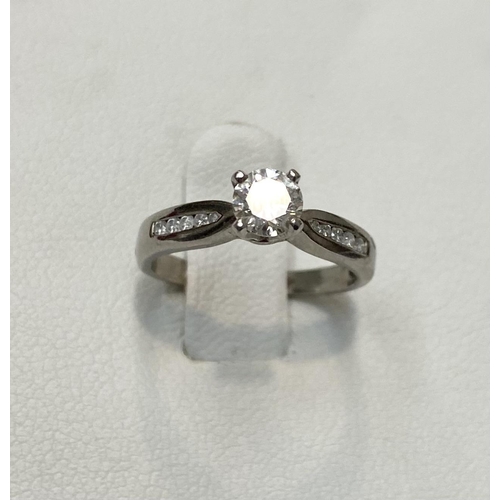 180 - AN 18CT WHITE GOLD DIAMOND SOLITAIRE RING, complete with diamond shoulders this pretty piece has a r... 