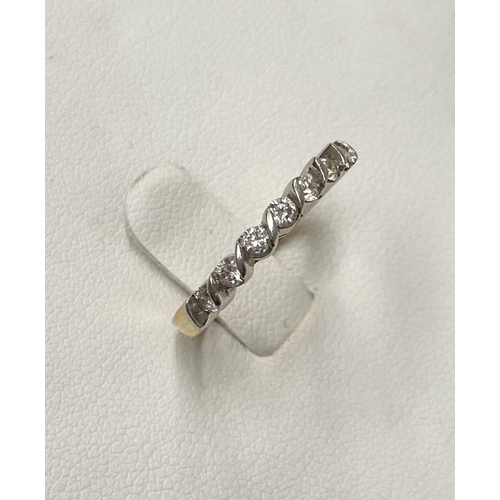 184 - AN 18CT YELLOW GOLD SEVEN STONE DIAMOND RING, the seven diamonds are set in a white gold swirl setti... 