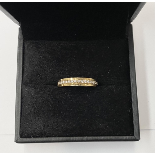 185 - AN 18 CT YELLOW GOLD HALF ETERNITY DIAMOND RING, the 16 diamonds are claw set , ring size M