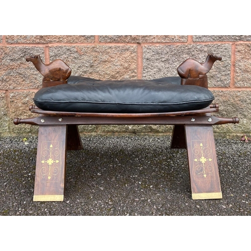 188 - A CARVED ROSEWOOD AND LEATHER FOOT STOOL, c.1960, with marquetry inlay, tufted leather cushion and c... 