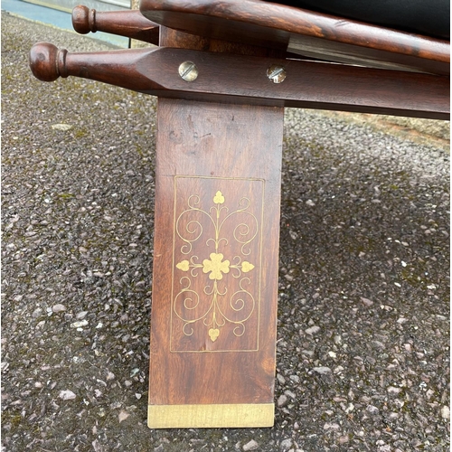 188 - A CARVED ROSEWOOD AND LEATHER FOOT STOOL, c.1960, with marquetry inlay, tufted leather cushion and c... 