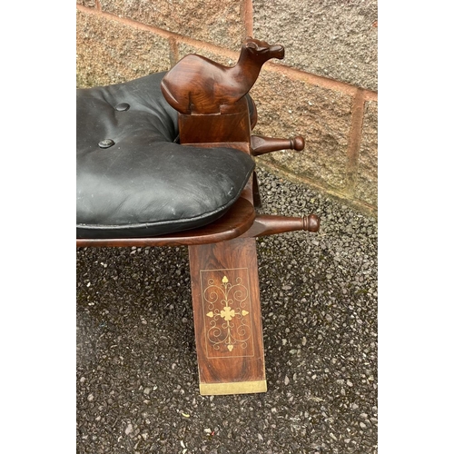 188 - A CARVED ROSEWOOD AND LEATHER FOOT STOOL, c.1960, with marquetry inlay, tufted leather cushion and c... 