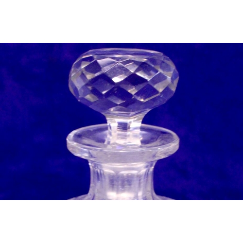 19 - A SMALL CROSSHATCH MOULDED GLASS DECANTER, with broad fluted neck, with stopper, 15cm high approx.