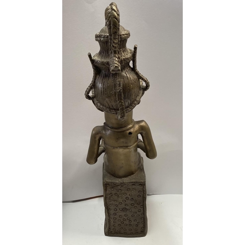 190 - AN ANTIQUE NIGERIAN CAST METAL STATUE, a female figure with traditional headdress, carrying a bowl, ... 