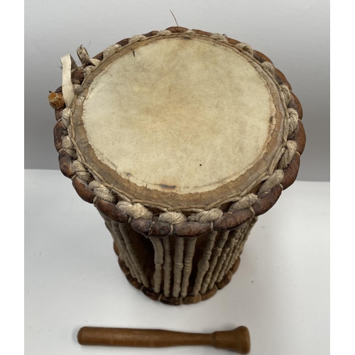 191 - A TRADITIONAL AFRICAN ‘TAKLING’ DRUM, hour-glass shaped pressure drum, so-named because of its abili... 