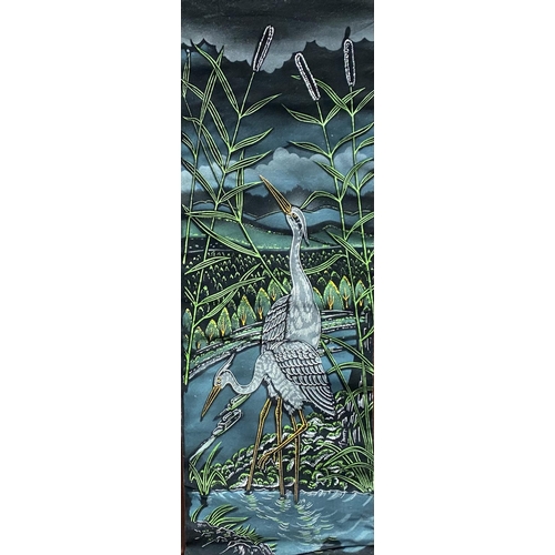 197 - A PAINTED WALL HANGING, depicting two herons in a riverside scene, surrounded by cattail plants. Fin... 