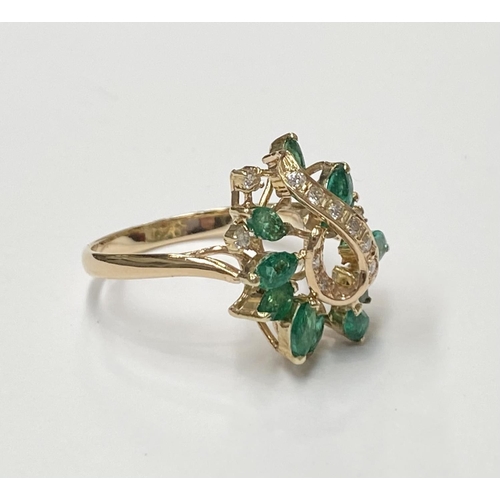 20 - A BEAUTIFUL 14CT YELLOW GOLD EMERALD & DIAMOND COCKTAIL RING, the movement in the design of this pie... 