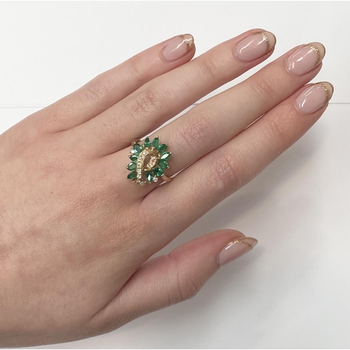 20 - A BEAUTIFUL 14CT YELLOW GOLD EMERALD & DIAMOND COCKTAIL RING, the movement in the design of this pie... 