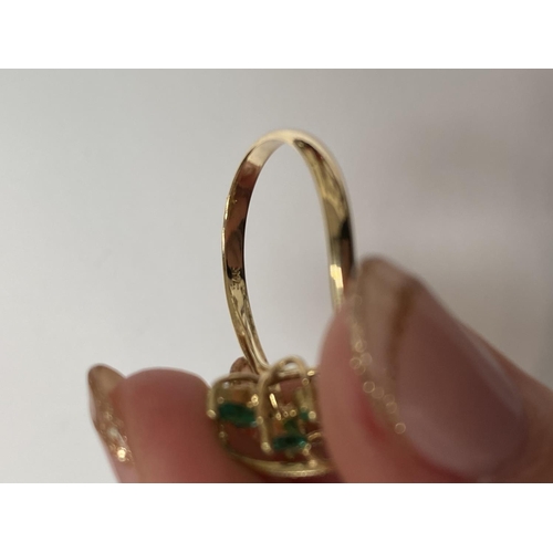 20 - A BEAUTIFUL 14CT YELLOW GOLD EMERALD & DIAMOND COCKTAIL RING, the movement in the design of this pie... 