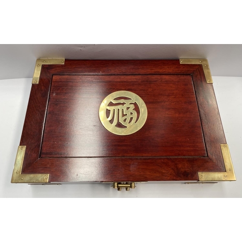 200 - A CHINESE ROSEWOOD JEWELLERY BOX, c.1960, with ornate brass trim, centre with brass Chinese characte... 