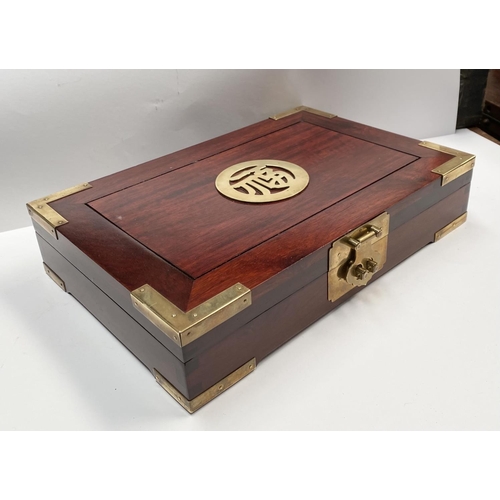 200 - A CHINESE ROSEWOOD JEWELLERY BOX, c.1960, with ornate brass trim, centre with brass Chinese characte... 