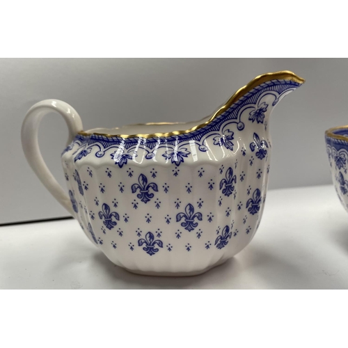 204 - A VINTAGE SPODE FINE BONE CHINA TEA SET, in the ‘Fleur de Lys Blue’ pattern, to include a teapot, si... 