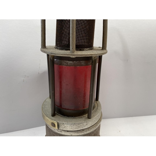 232 - AN ANTIQUE MINERS SAFETY LAMP, this form of lamp was approved for use in mines due to its improved v... 