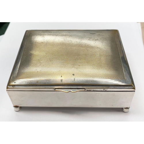 233 - AN ANTIQUE SILVER PLATED TRINKET BOX / CIGARETTE BOX, with engine turned design to centre, hinge ope... 