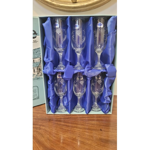 239 - A SET OF 6 DUISKE IRISH HANDCUT GLASSES, with floral motif; each glass 18cm tall. In original presen... 