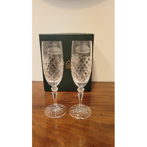 240 - A PAIR OF BOXED GALWAY CHRYSTAL WEDDING GLASSES, Bride & Groom champagne flutes; each glass engraved... 