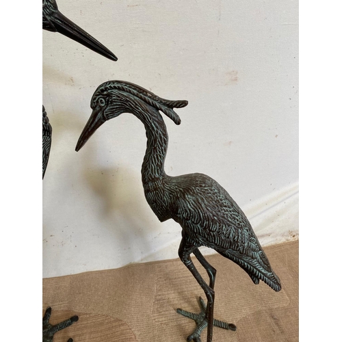 245 - A PAIR OF BRONZE STYLE GARDEN ORNAMENTS IN THE FORM OF CRANES, finely cast, Dimensions: larger: 85cm... 