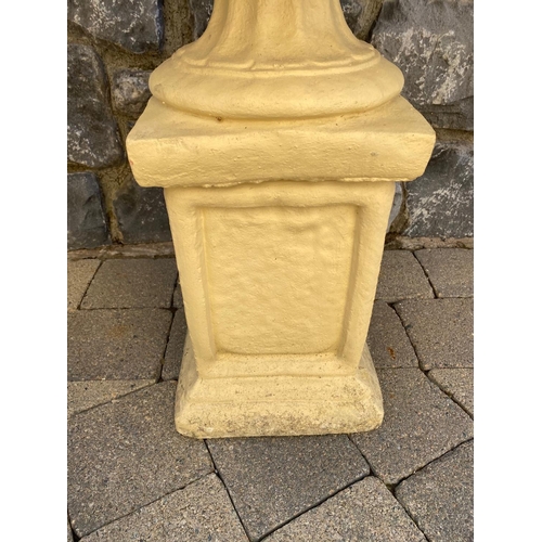 247 - A PAIR OF GARDEN URNS ON STANDS, urns with two handles, fluted base, supported by rectangular plinth... 