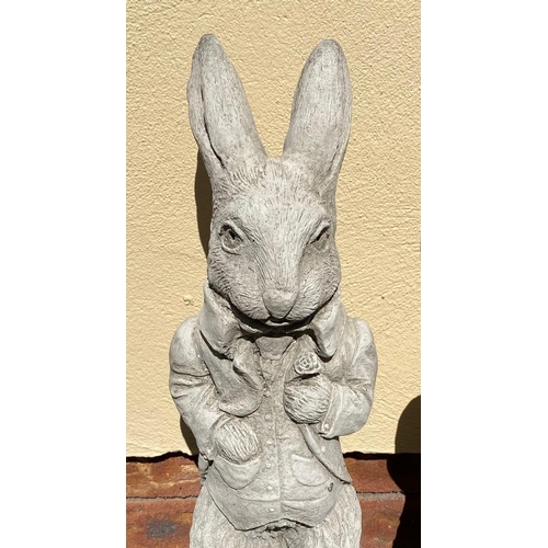 251 - A PAIR OF STONE GARDEN FIGURES, in the form of Peter Rabbits. Dimensions: 54cm high approx.