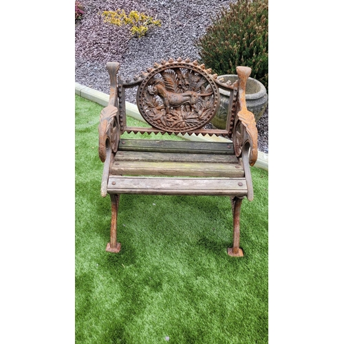 26 - A PAIR OF COALBROOKDALE STYLE CAST IRON GARDEN ARMCHAIRS, 	rust coloured, each with the hunting dog ... 