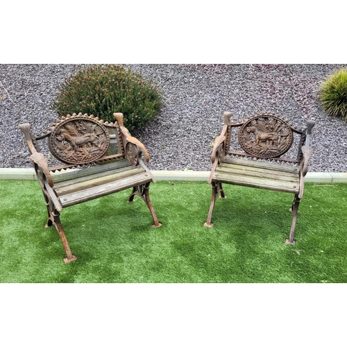 26 - A PAIR OF COALBROOKDALE STYLE CAST IRON GARDEN ARMCHAIRS, 	rust coloured, each with the hunting dog ... 