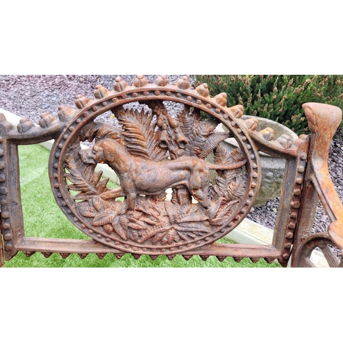 26 - A PAIR OF COALBROOKDALE STYLE CAST IRON GARDEN ARMCHAIRS, 	rust coloured, each with the hunting dog ... 