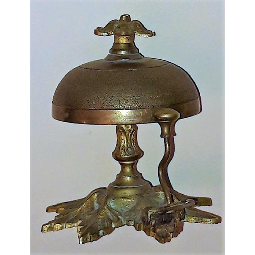 260 - A BRASS EDWARDIAN DESK BELL, in working order. Nice decorative item. 11cm tall.