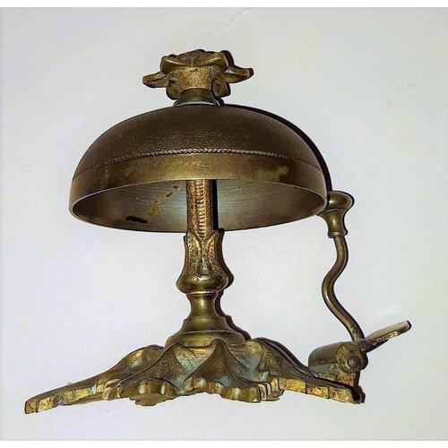 260 - A BRASS EDWARDIAN DESK BELL, in working order. Nice decorative item. 11cm tall.