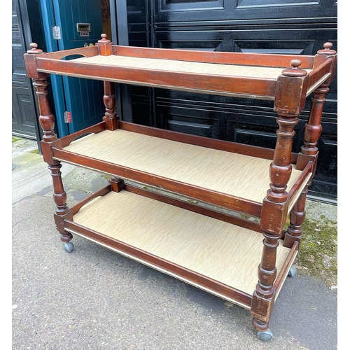 262 - A GOOD QUALITY MAHOGANY THREE TIER DUMB WAITER, with turned supports on castors. Condition: In very ... 