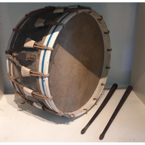 263 - AN ANTIQUE DRUM & DRUMSTICKS, with centre tin drum and wooden frame bound with rope. Comes with a pa... 