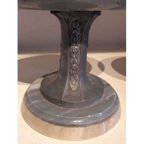 265 - A PAIR OF ART DECO CARVED MARBLE & PEWTER ORNAMENTS / STANDS, with circular tops over a pinched pewt... 